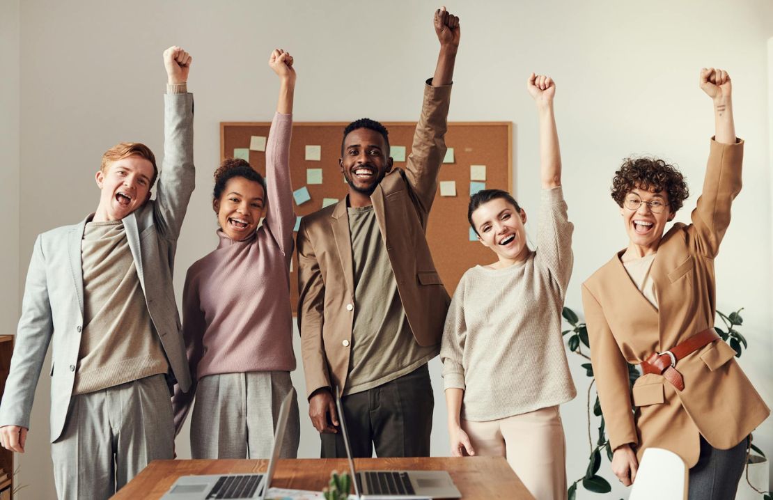 team of people diverse enjoying success and achievements